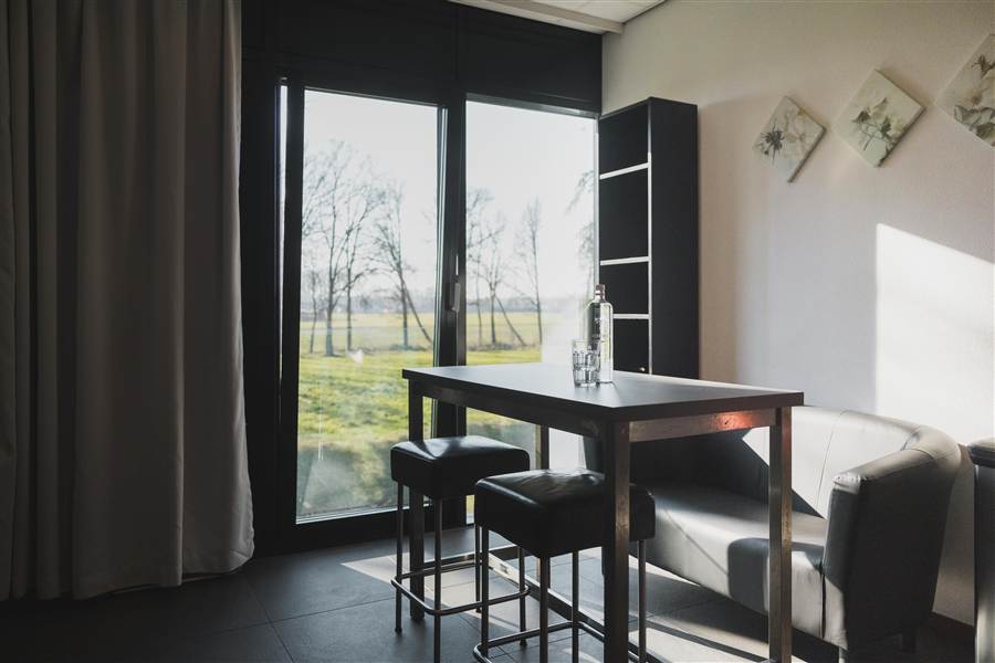 Gedeelde woonkamer bij een Welcome Housing-locatie